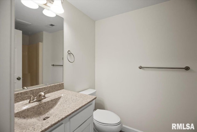3024 Allis St, Springfield, IL 62703 - bathroom with toilet, vanity, and baseboards