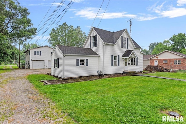 417 W Franklin St, Girard, IL 62640 - view of front of home with driveway, a shingled roof, a front yard, and an attached garage