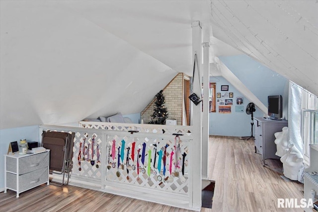 417 W Franklin St, Girard, IL 62640 - bedroom featuring wood finished floors and vaulted ceiling