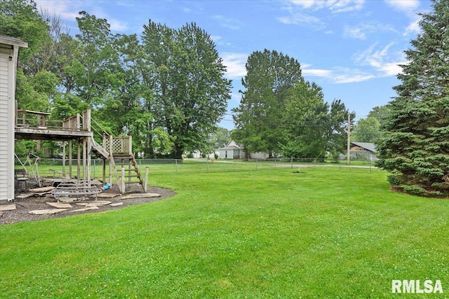 417 W Franklin St, Girard, IL 62640 - view of yard featuring stairway, a wooden deck, and view of wooded area
