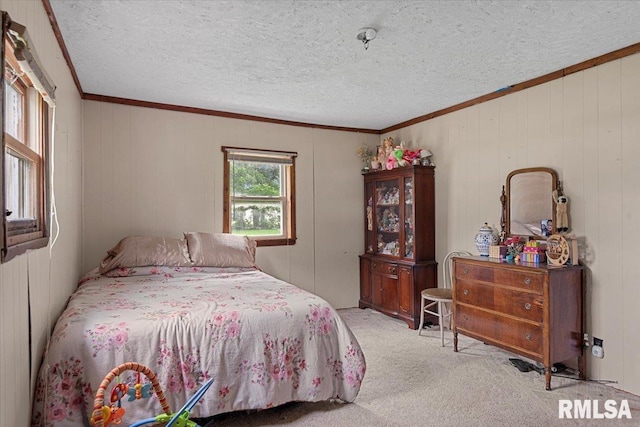 417 W Franklin St, Girard, IL 62640 - bedroom with carpet flooring, ornamental molding, a textured ceiling, and wooden walls