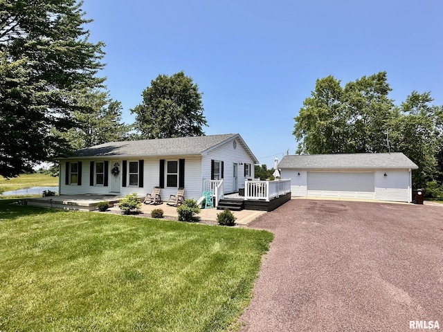 2900 Old State Rd, Alexander, IL 62601 - single story home with a garage, a front lawn, a deck, and an outbuilding