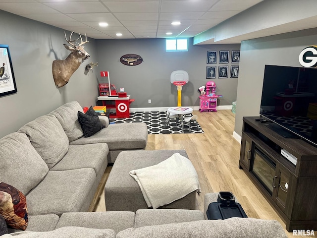 2900 Old State Rd, Alexander, IL 62601 - living room featuring light wood-style flooring, recessed lighting, baseboards, and a paneled ceiling