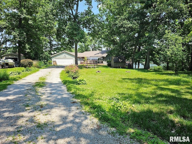 12862 Winnebago Dr, Plainview, IL 62685 - view of front facade with a garage and a front yard