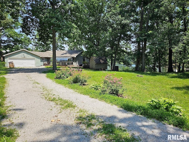 12862 Winnebago Dr, Plainview, IL 62685 - single story home with gravel driveway, a front lawn, and a garage
