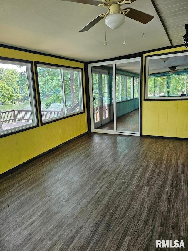 12862 Winnebago Dr, Plainview, IL 62685 - unfurnished sunroom featuring a ceiling fan, wood finished floors, and wood walls