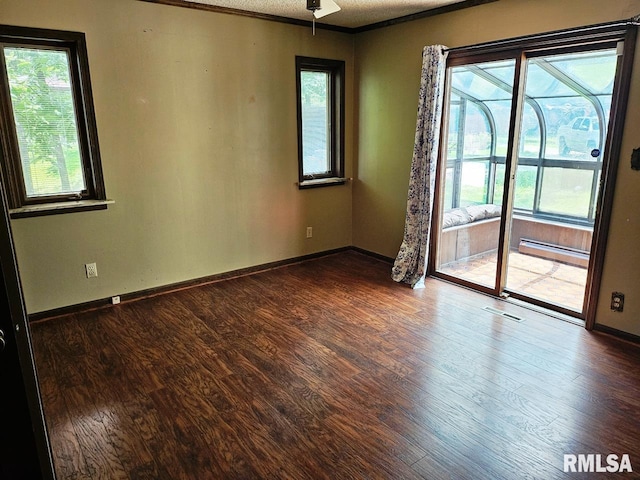 12862 Winnebago Dr, Plainview, IL 62685 - empty room with wood finished floors, plenty of natural light, baseboards, ornamental molding, and ceiling fan