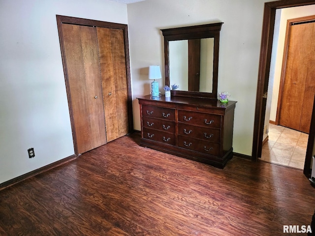 12862 Winnebago Dr, Plainview, IL 62685 - bedroom featuring wood finished floors, a closet, and baseboards