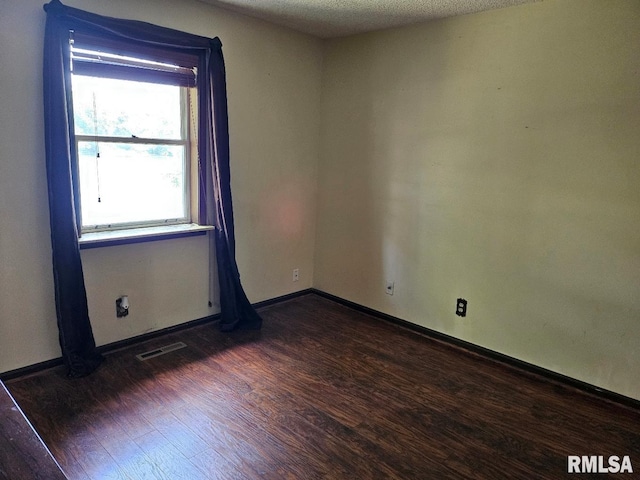 12862 Winnebago Dr, Plainview, IL 62685 - unfurnished room with wood finished floors and baseboards