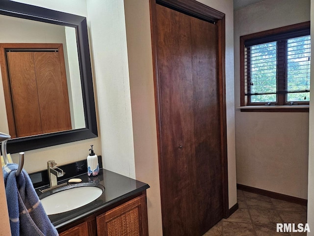 12862 Winnebago Dr, Plainview, IL 62685 - bathroom featuring vanity, tile patterned floors, and baseboards