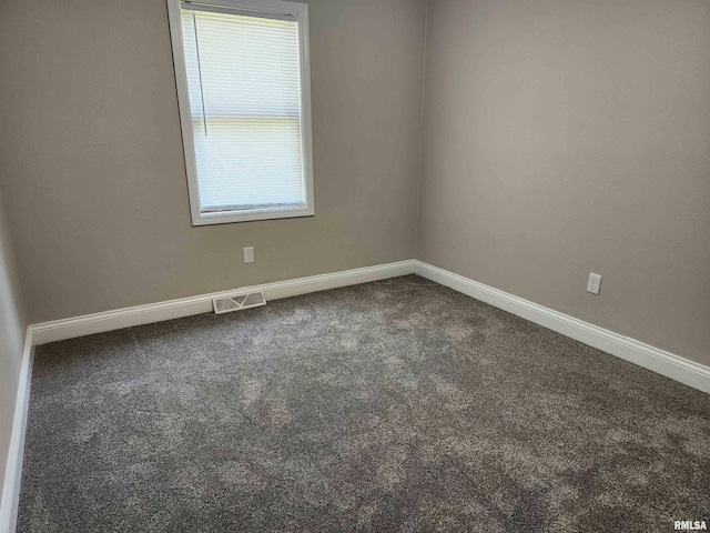 208 Elm St, Dawson, IL 62520 - unfurnished room featuring dark colored carpet and baseboards