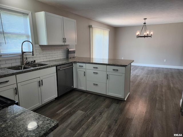 208 Elm St, Dawson, IL 62520 - kitchen with dishwasher, a sink, a peninsula, tasteful backsplash, and dark wood-type flooring