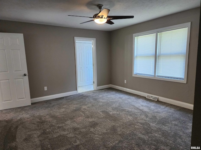 208 Elm St, Dawson, IL 62520 - carpeted spare room with ceiling fan and baseboards