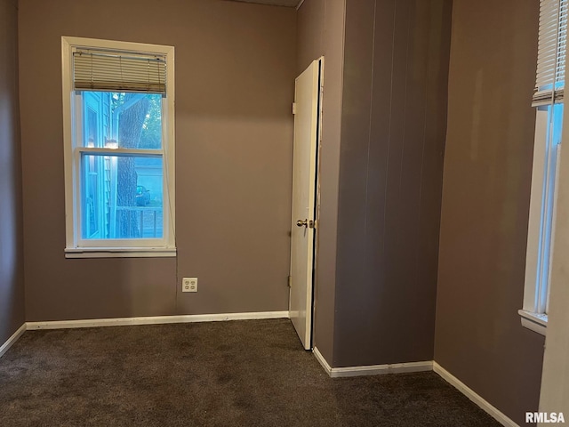 3208 E Elm St, Springfield, IL 62702 - spare room featuring dark colored carpet and baseboards