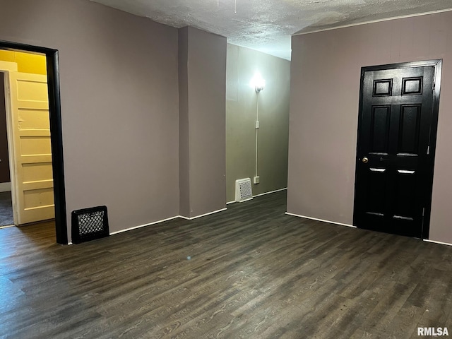 3208 E Elm St, Springfield, IL 62702 - spare room with dark wood finished floors and a textured ceiling