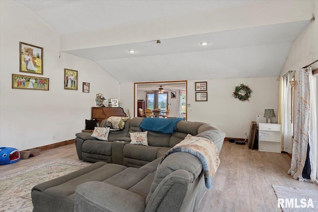 14455 E Dutch Henry Rd, Lewistown, IL 61542 - living room featuring lofted ceiling, light wood-style floors, baseboards, and ceiling fan