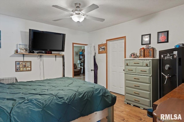 14455 E Dutch Henry Rd, Lewistown, IL 61542 - bedroom featuring light wood-style floors and ceiling fan
