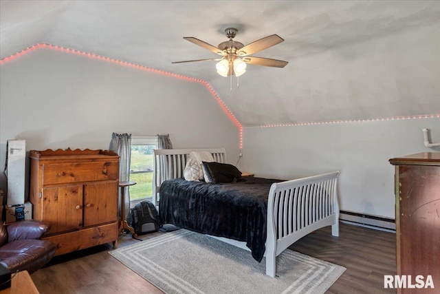 14455 E Dutch Henry Rd, Lewistown, IL 61542 - bedroom with baseboard heating, vaulted ceiling, wood finished floors, and a ceiling fan