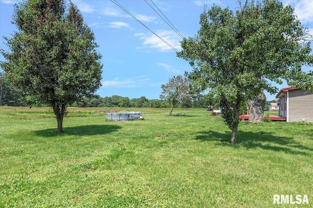 14455 E Dutch Henry Rd, Lewistown, IL 61542 - view of grassy yard with a covered pool