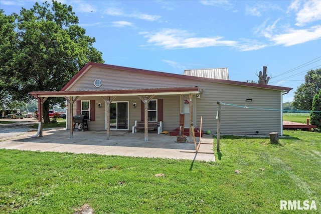 14455 E Dutch Henry Rd, Lewistown, IL 61542 - rear view of property with a yard and a patio