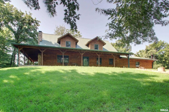 23790 277th Ln, Barry, IL 62312 - view of front of property with a chimney, a front yard, a metal roof, and a porch