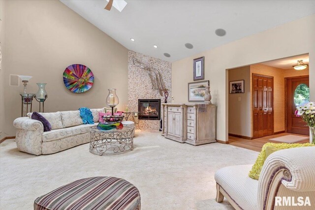 9 Windfall Ln, Cantrall, IL 62625 - living room with carpet floors, a fireplace, and high vaulted ceiling