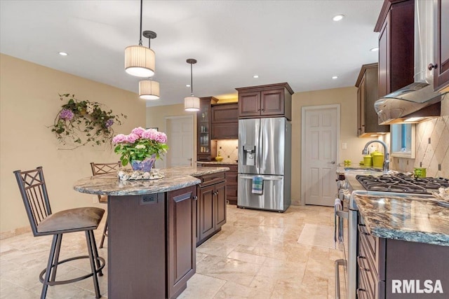 9 Windfall Ln, Cantrall, IL 62625 - kitchen featuring appliances with stainless steel finishes, backsplash, wall chimney exhaust hood, a breakfast bar, and a center island