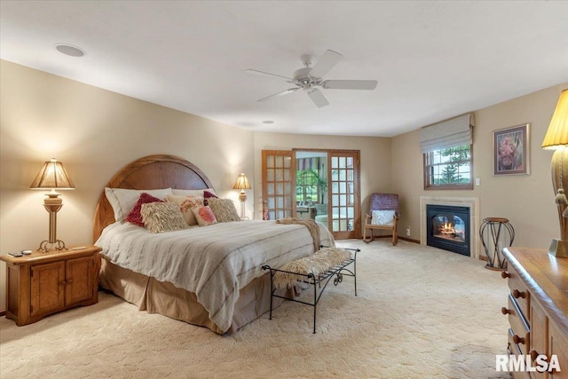9 Windfall Ln, Cantrall, IL 62625 - bedroom with light carpet, a glass covered fireplace, and ceiling fan