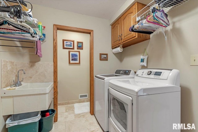 9 Windfall Ln, Cantrall, IL 62625 - laundry area featuring independent washer and dryer and cabinet space
