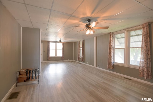 931 W Vandeveer St, Taylorville, IL 62568 - unfurnished room featuring ceiling fan, light wood finished floors, and a drop ceiling