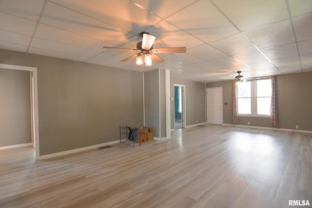 931 W Vandeveer St, Taylorville, IL 62568 - empty room featuring a ceiling fan, a paneled ceiling, and light wood-type flooring