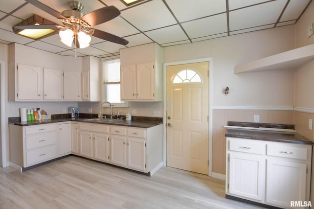 931 W Vandeveer St, Taylorville, IL 62568 - kitchen with open shelves, a ceiling fan, white cabinetry, light wood-type flooring, and a drop ceiling