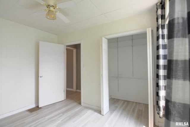 931 W Vandeveer St, Taylorville, IL 62568 - unfurnished bedroom with light wood-style flooring, a closet, and a ceiling fan