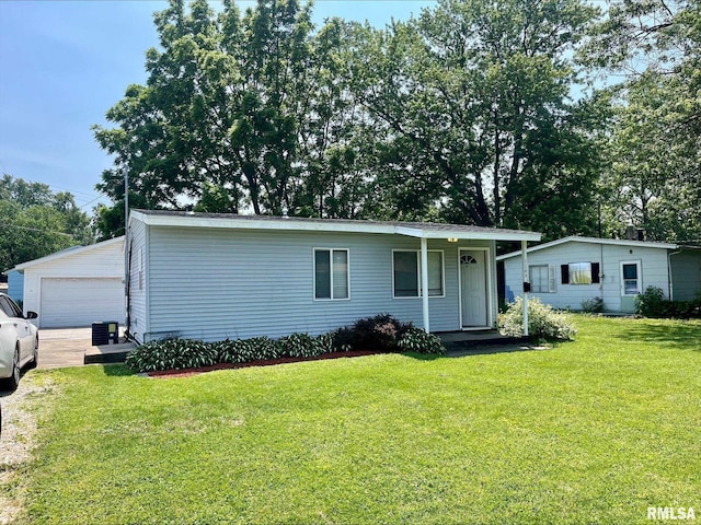 1164 Arcadia Dr, Galesburg, IL 61401 - view of front of house with a front lawn, a garage, and an outdoor structure