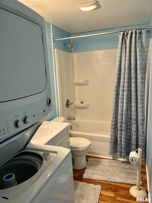 1164 Arcadia Dr, Galesburg, IL 61401 - bathroom featuring stacked washing machine and dryer, shower / bath combo, wood finished floors, and vanity