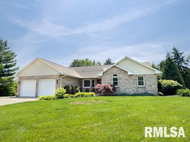 6718 Shadow Ln, Quincy, IL 62305 - single story home featuring an attached garage, a front lawn, brick siding, and concrete driveway