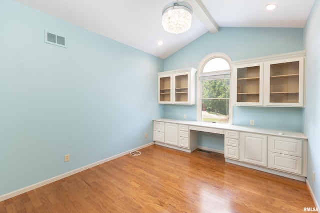 6718 Shadow Ln, Quincy, IL 62305 - unfurnished office featuring built in study area, light wood-style floors, and a chandelier