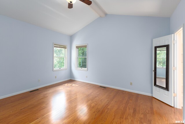 6718 Shadow Ln, Quincy, IL 62305 - unfurnished room featuring beam ceiling, plenty of natural light, a ceiling fan, light wood-style flooring, and high vaulted ceiling