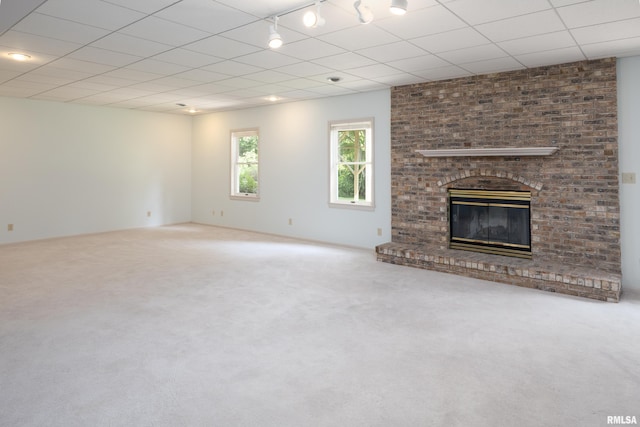 6718 Shadow Ln, Quincy, IL 62305 - unfurnished living room with carpet and a fireplace