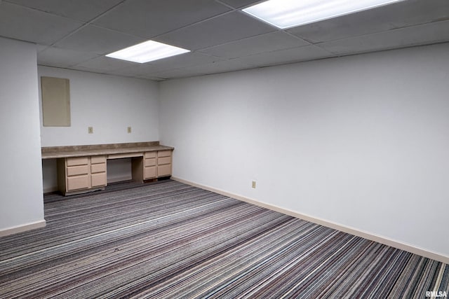 6718 Shadow Ln, Quincy, IL 62305 - unfurnished office featuring dark carpet, built in study area, and a paneled ceiling
