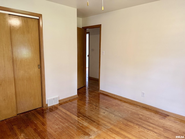 465 Fifer St, Galesburg, IL 61401 - unfurnished bedroom featuring wood-type flooring and a closet