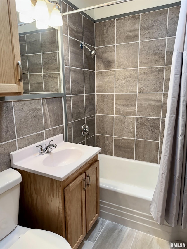 465 Fifer St, Galesburg, IL 61401 - bathroom with shower / bath combo, vanity, and tile walls