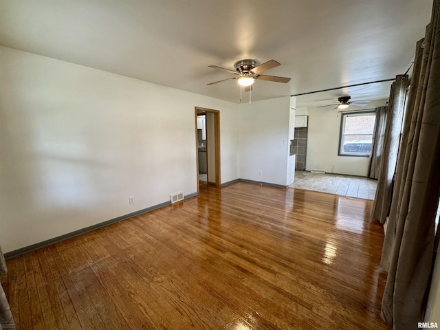 465 Fifer St, Galesburg, IL 61401 - spare room featuring light wood-type flooring and a ceiling fan