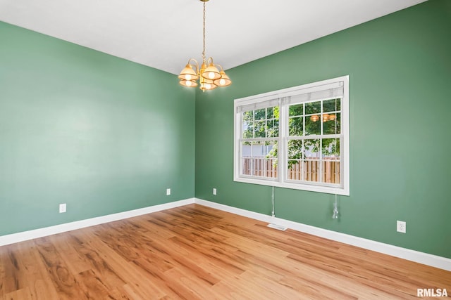 230 Possum Pass Ct, Sherman, IL 62684 - empty room with a chandelier and wood finished floors