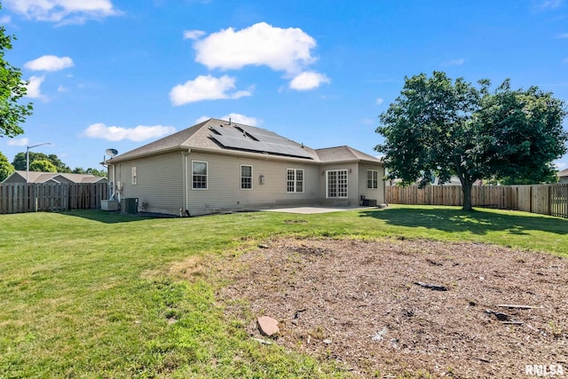 230 Possum Pass Ct, Sherman, IL 62684 - back of property featuring a patio, roof mounted solar panels, and a fenced backyard
