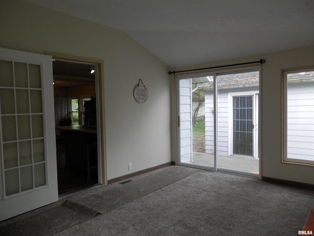 104 Henderson Rd, Knoxville, IL 61448 - carpeted empty room featuring lofted ceiling and healthy amount of natural light