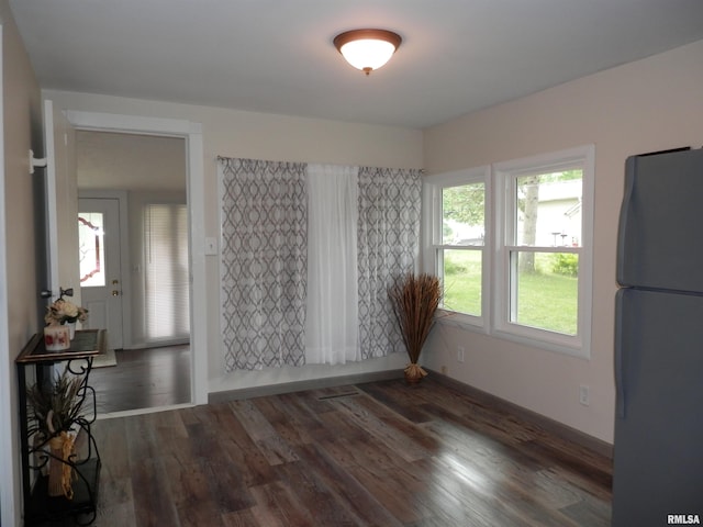 104 Henderson Rd, Knoxville, IL 61448 - unfurnished dining area featuring wood finished floors and baseboards