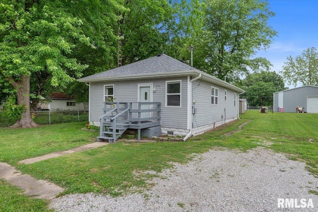 402 Linkins Ave, Tovey, IL 62570 - view of front facade with roof with shingles, driveway, and a garage