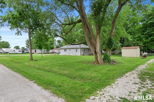 402 Linkins Ave, Tovey, IL 62570 - view of green lawn featuring a storage unit