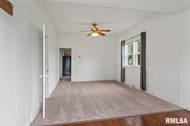 402 Linkins Ave, Tovey, IL 62570 - carpeted empty room featuring a ceiling fan and wood finished floors